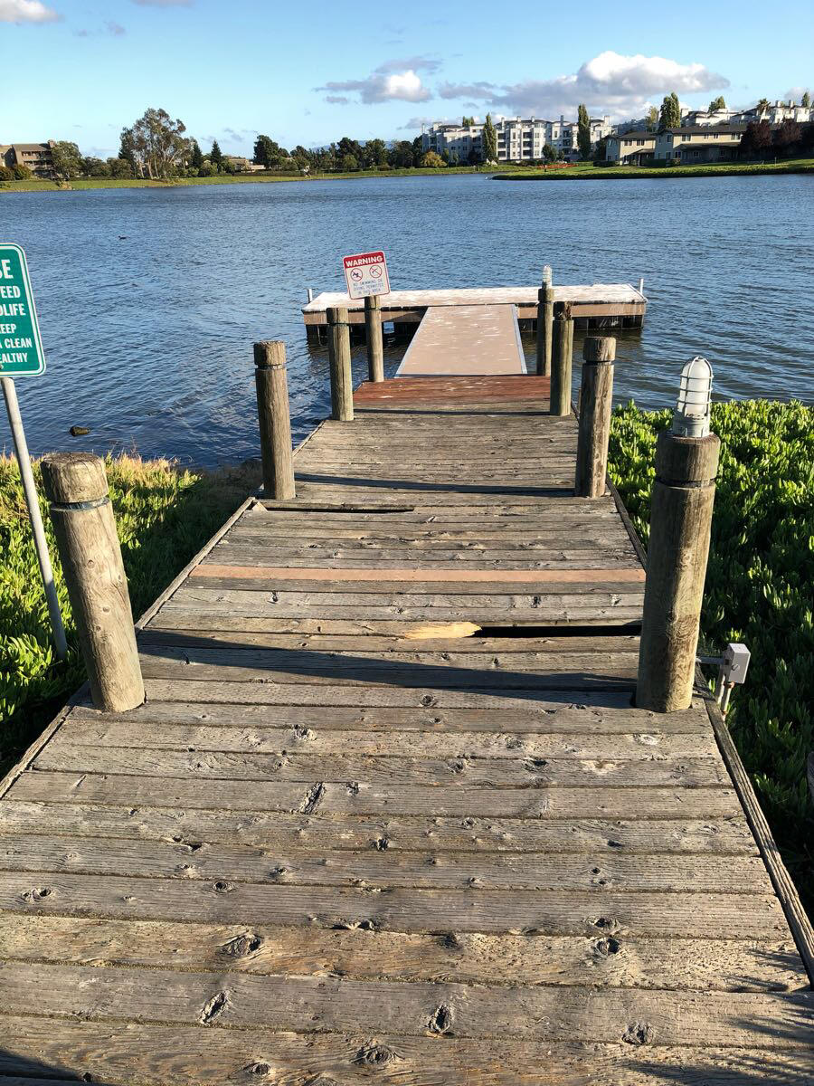 Edgewater Isle dock has 2 holes. Edgewater Isle Master Association did not repair dock