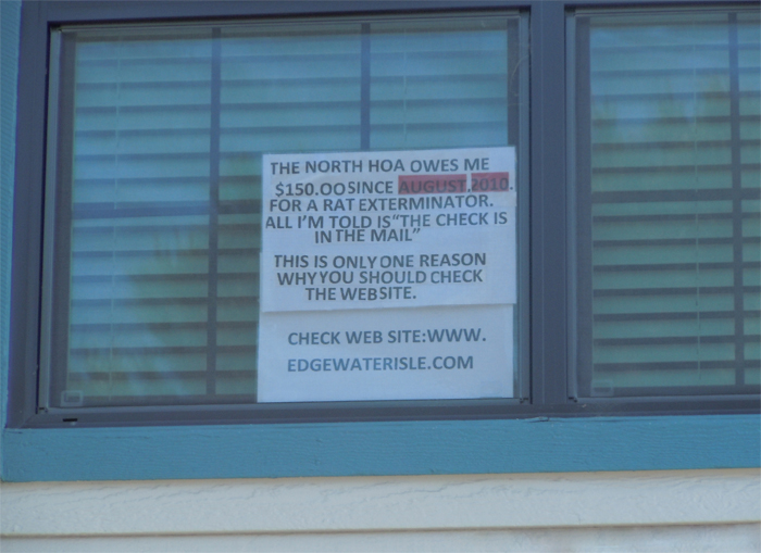 Sign in condo window at Edgewater Isle
